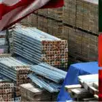 Construction materials with a U.S. flag on one side and a Chinese, Canadian and Mexican flag on the other.