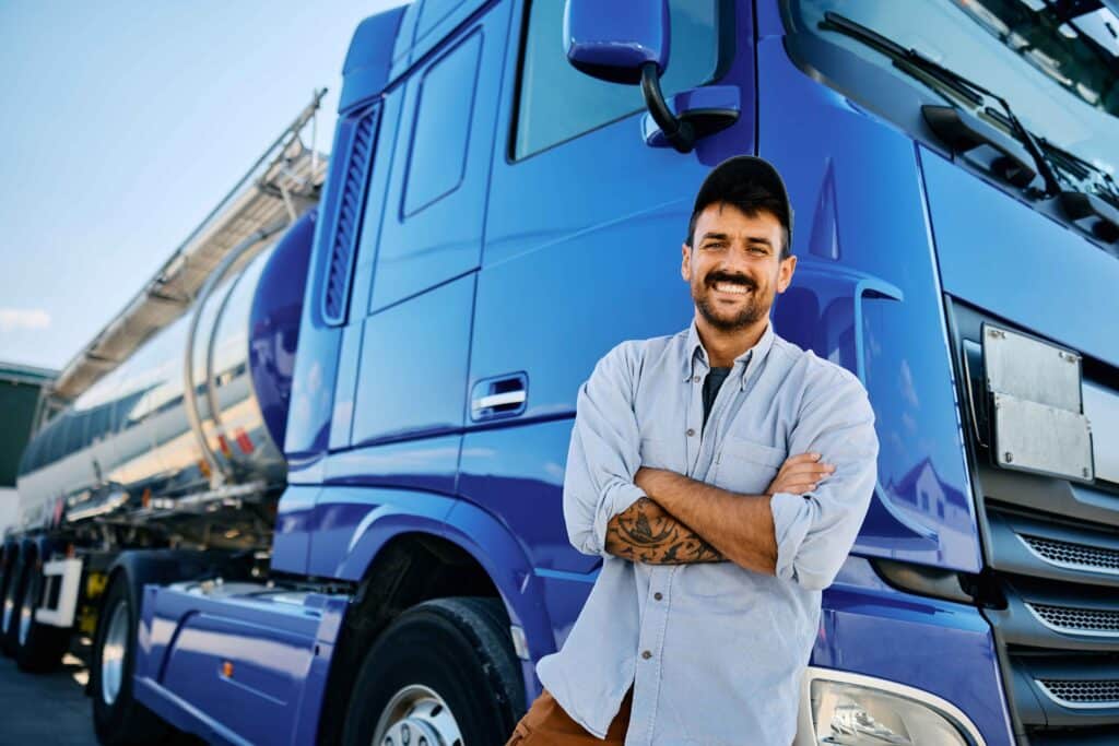 happy-professional-truck-driver-with-crossed-arms-2024-12-13-18-32-44-utc_11zon